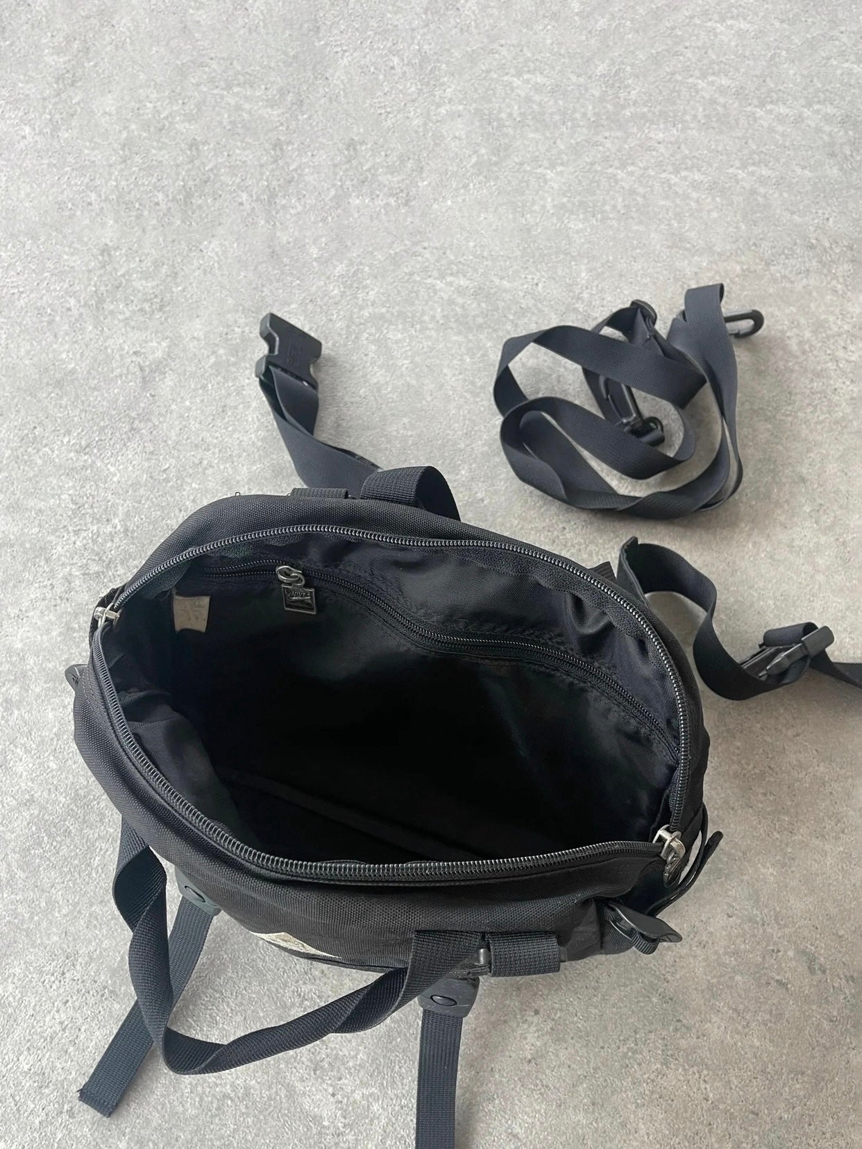 nike acg 1990s crossbody technical utility bag, compartment and buckle detail