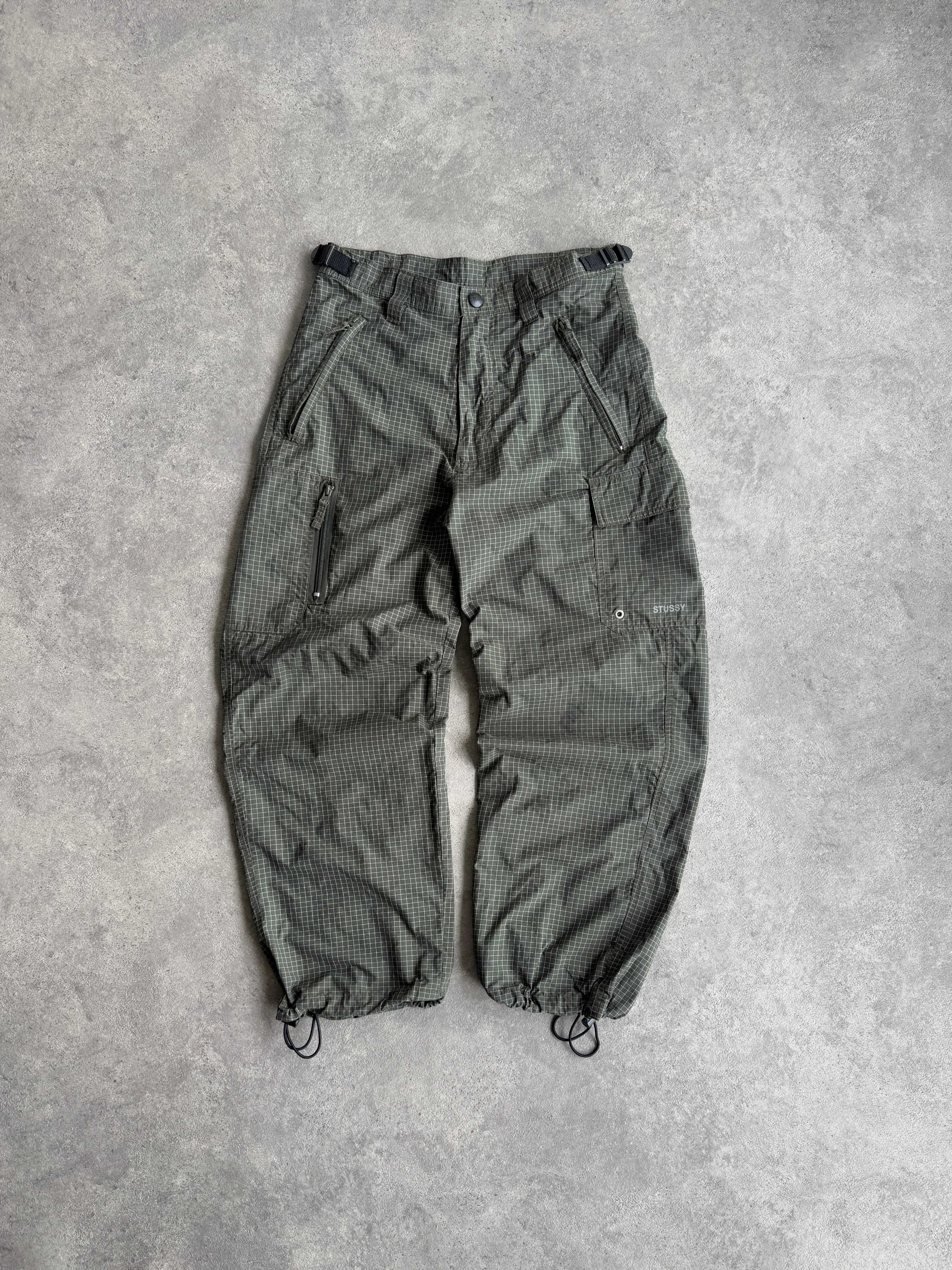 stussy 1990s technical parachute pants in olive grid, front view