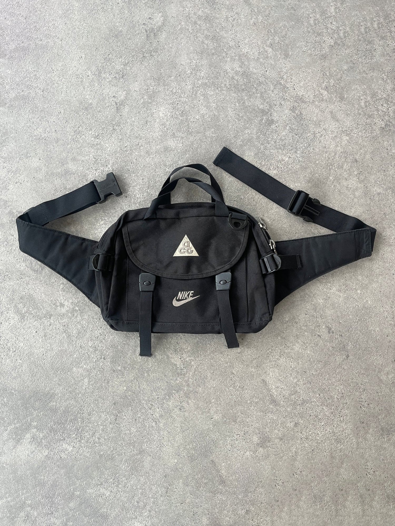 nike acg 1990s crossbody technical utility bag in black, front view