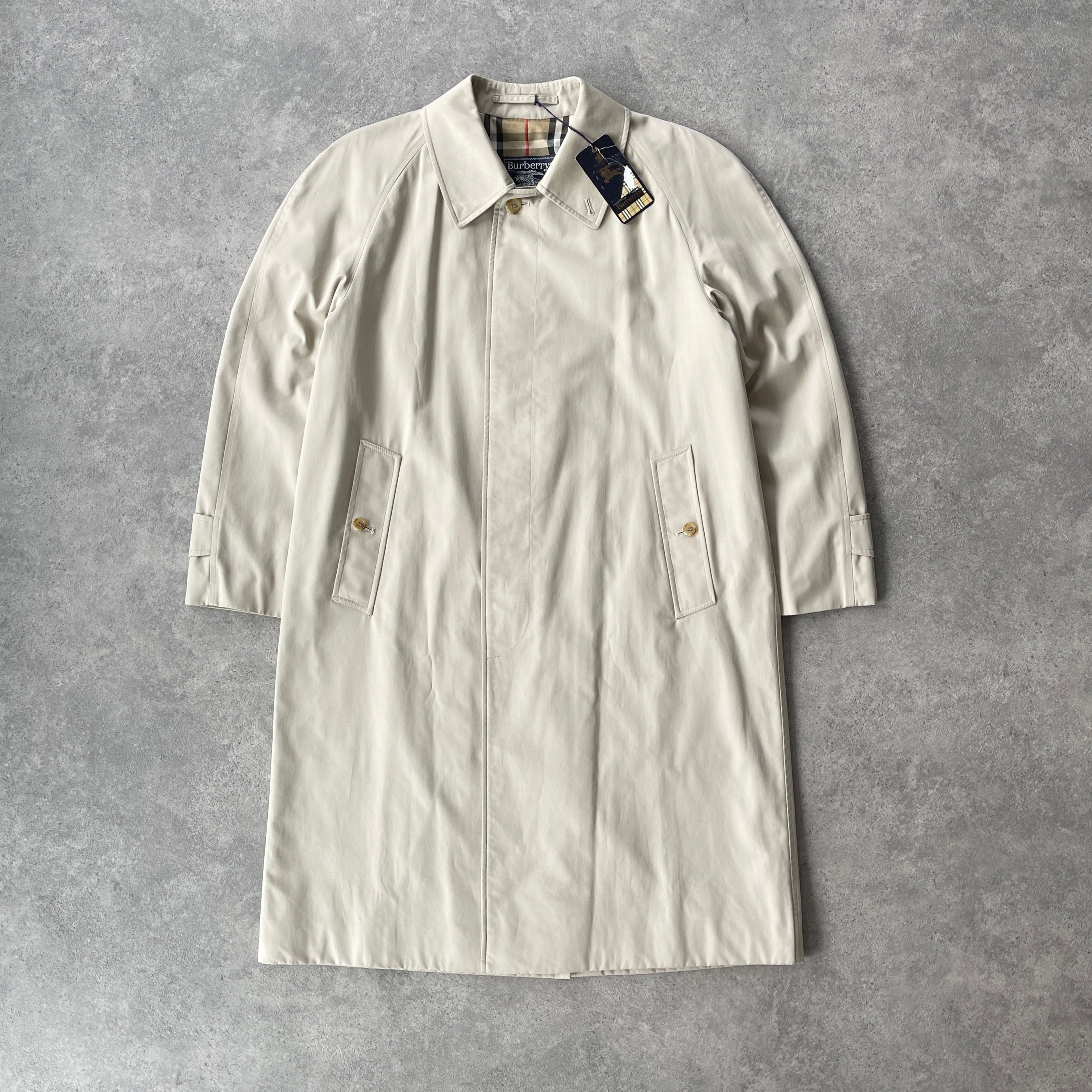 Burberry’s 1990s nova check cream trench jacket (M)