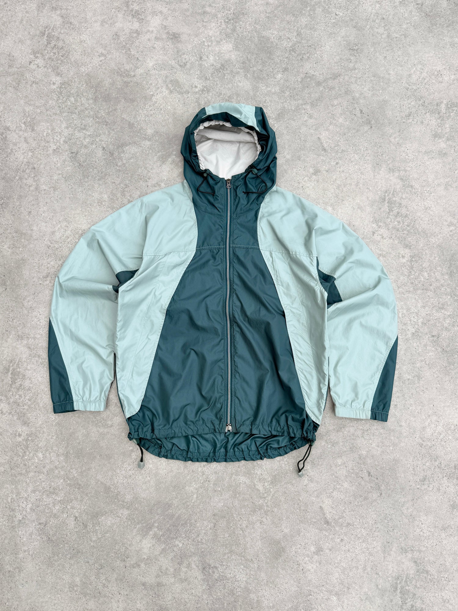 nike acg 1990s colour block packable jacket in teal ice-blue, front view