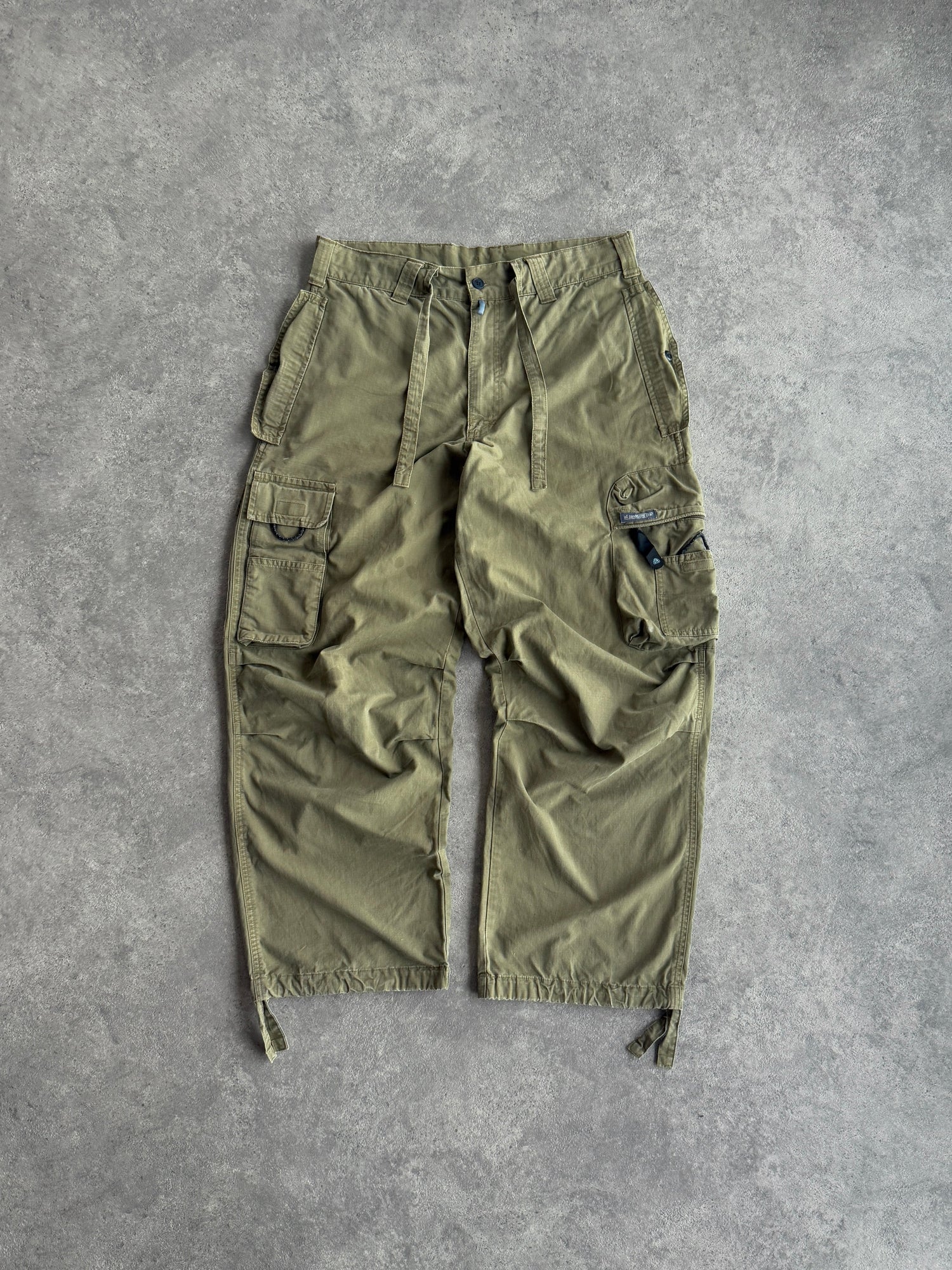 nike acg 2000s technical ripstop cargo trousers in olive green, front view