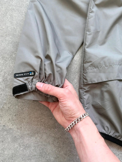 nike acg 1990s packable shell jacket, folded into integrated pouch