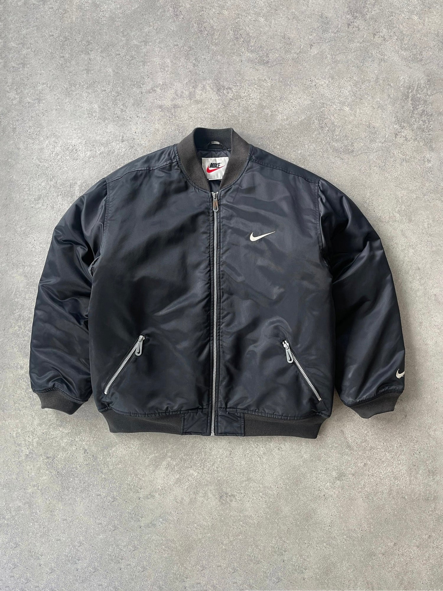 nike 1990s heavyweight padded bomber jacket in black, front view