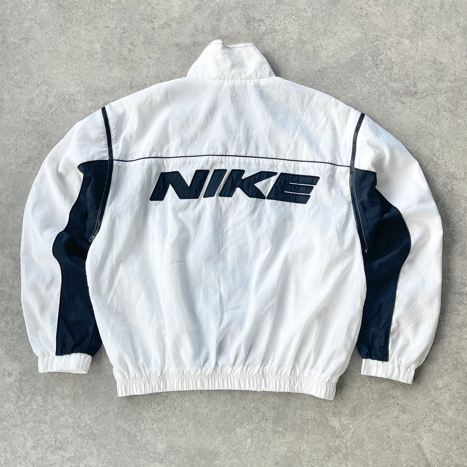 Nike 1990s lightweight convertible spellout shell jacket (S)