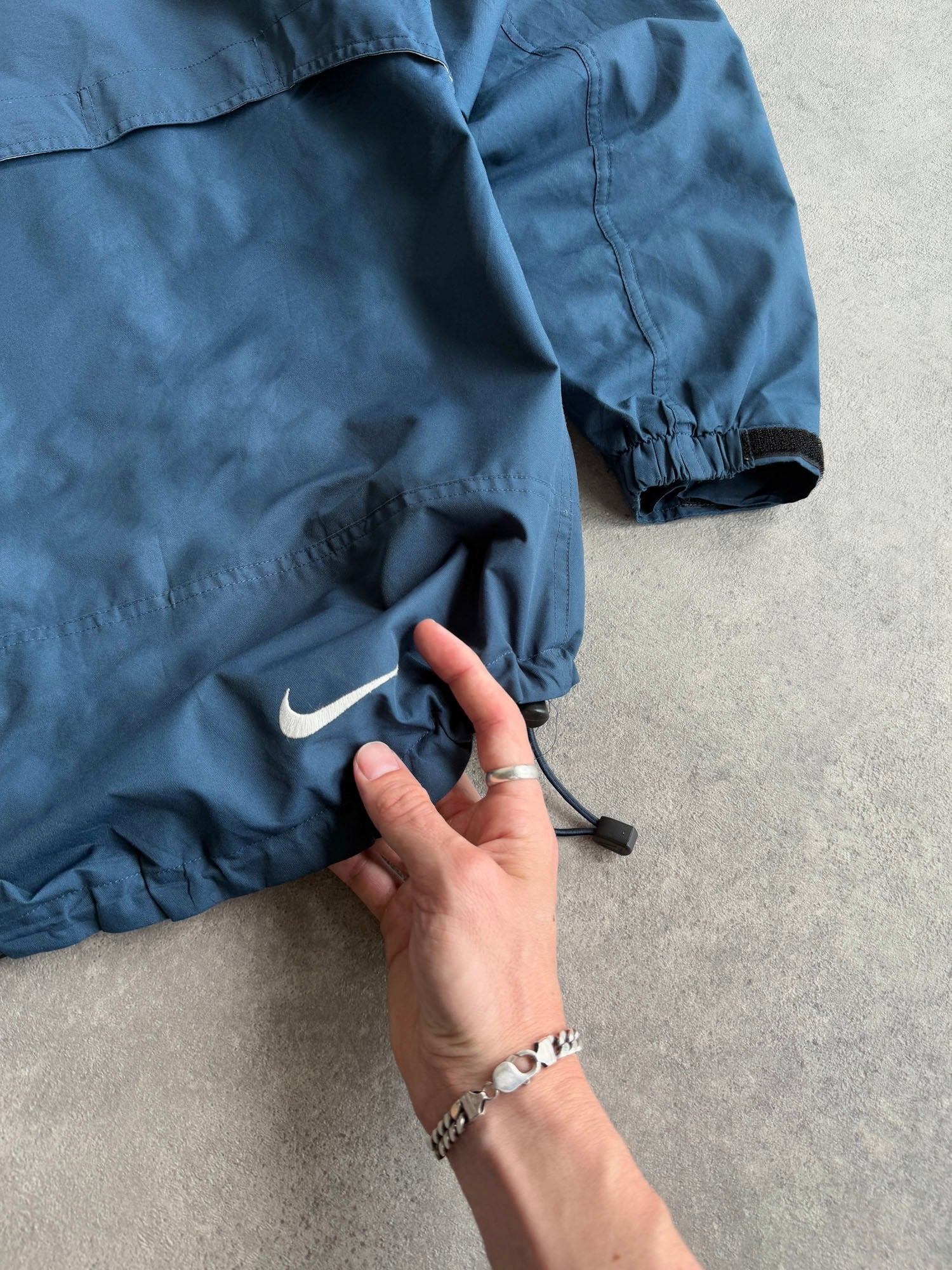 nike acg 1990s lightweight technical waterproof jacket, orange neck loop detail