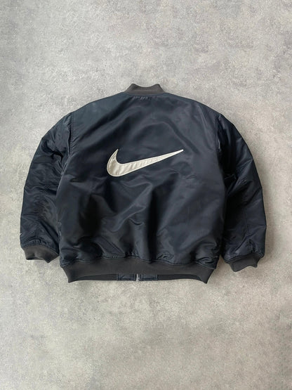 nike 1990s heavyweight padded bomber jacket in black, back with oversized swoosh
