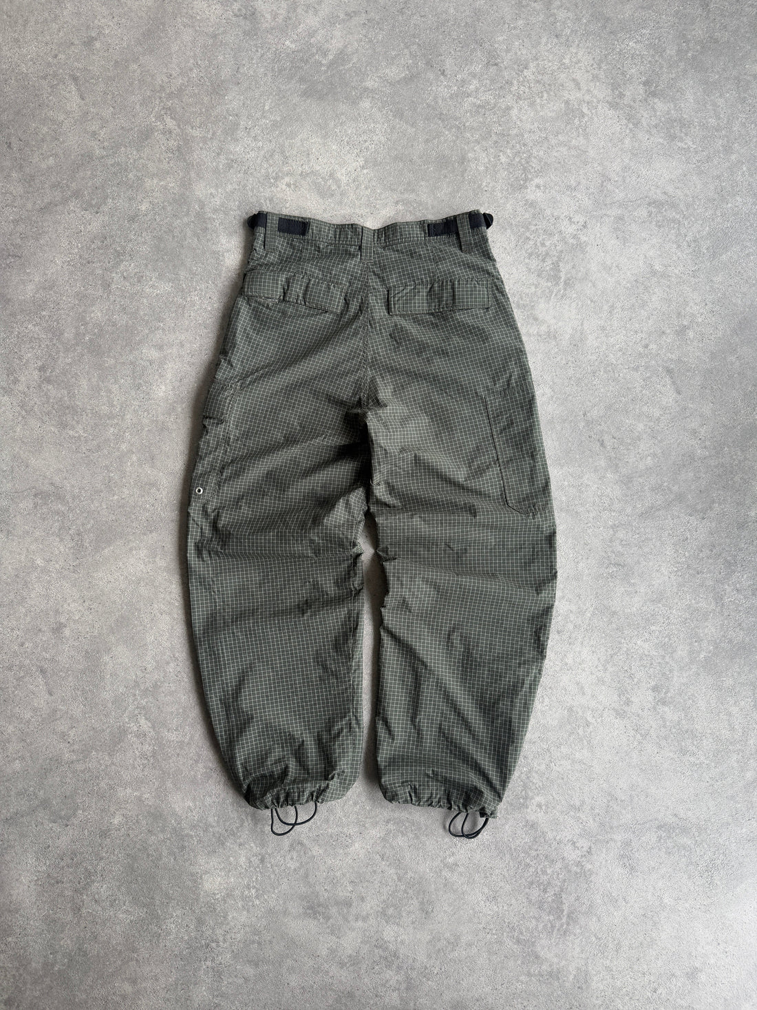 stussy 1990s technical parachute pants in olive grid, back view