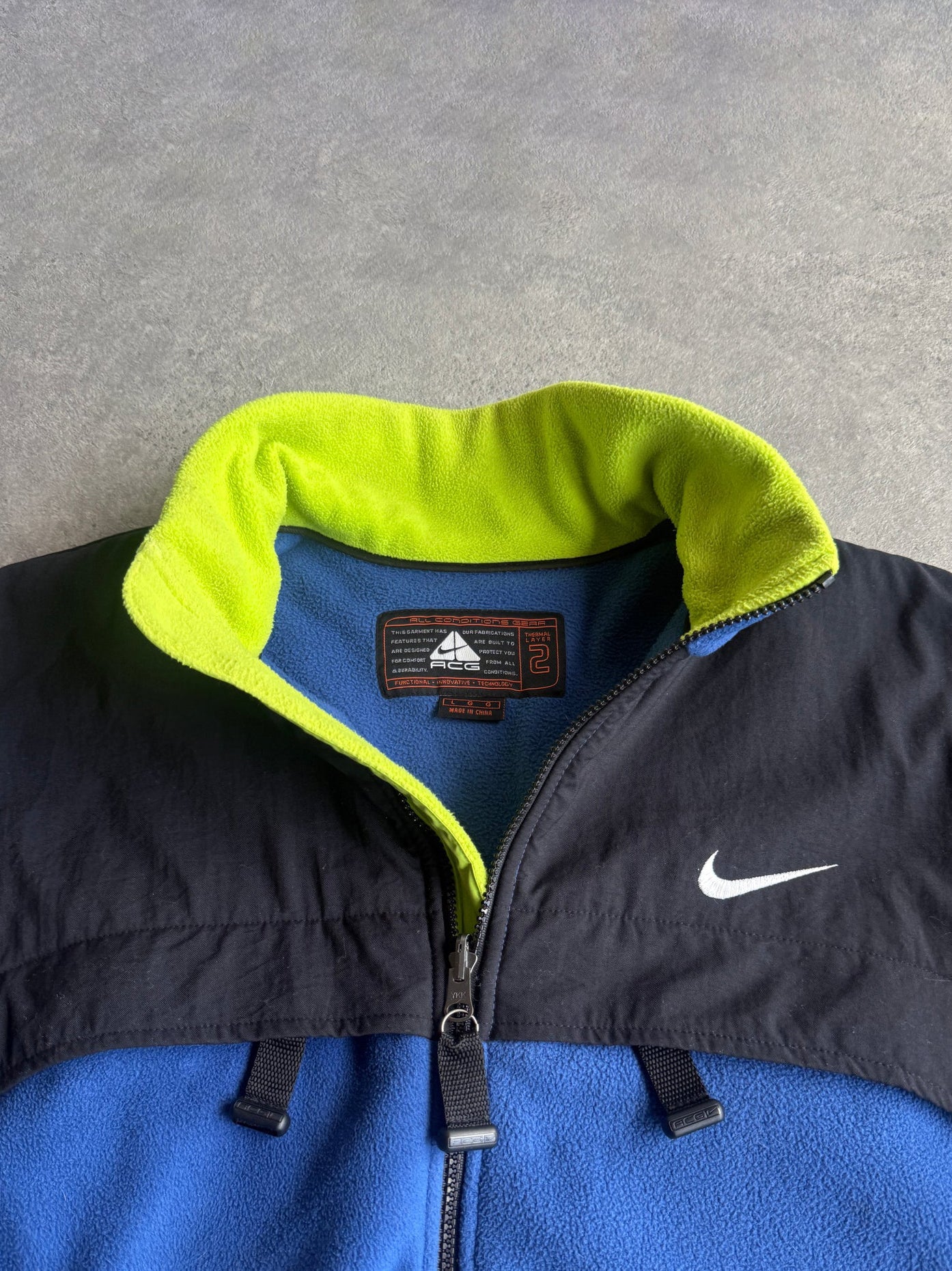 nike acg 1998 polartec fleece jacket in blue neon, side view