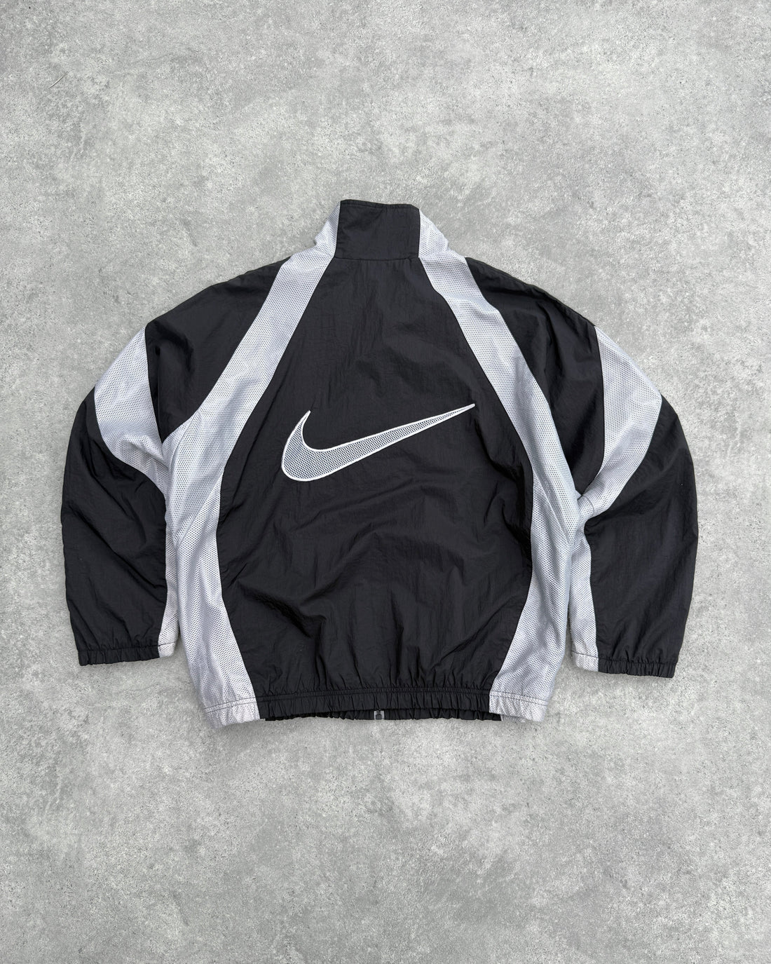 nike air 1990s lightweight swoosh shell jacket, back swoosh graphic view