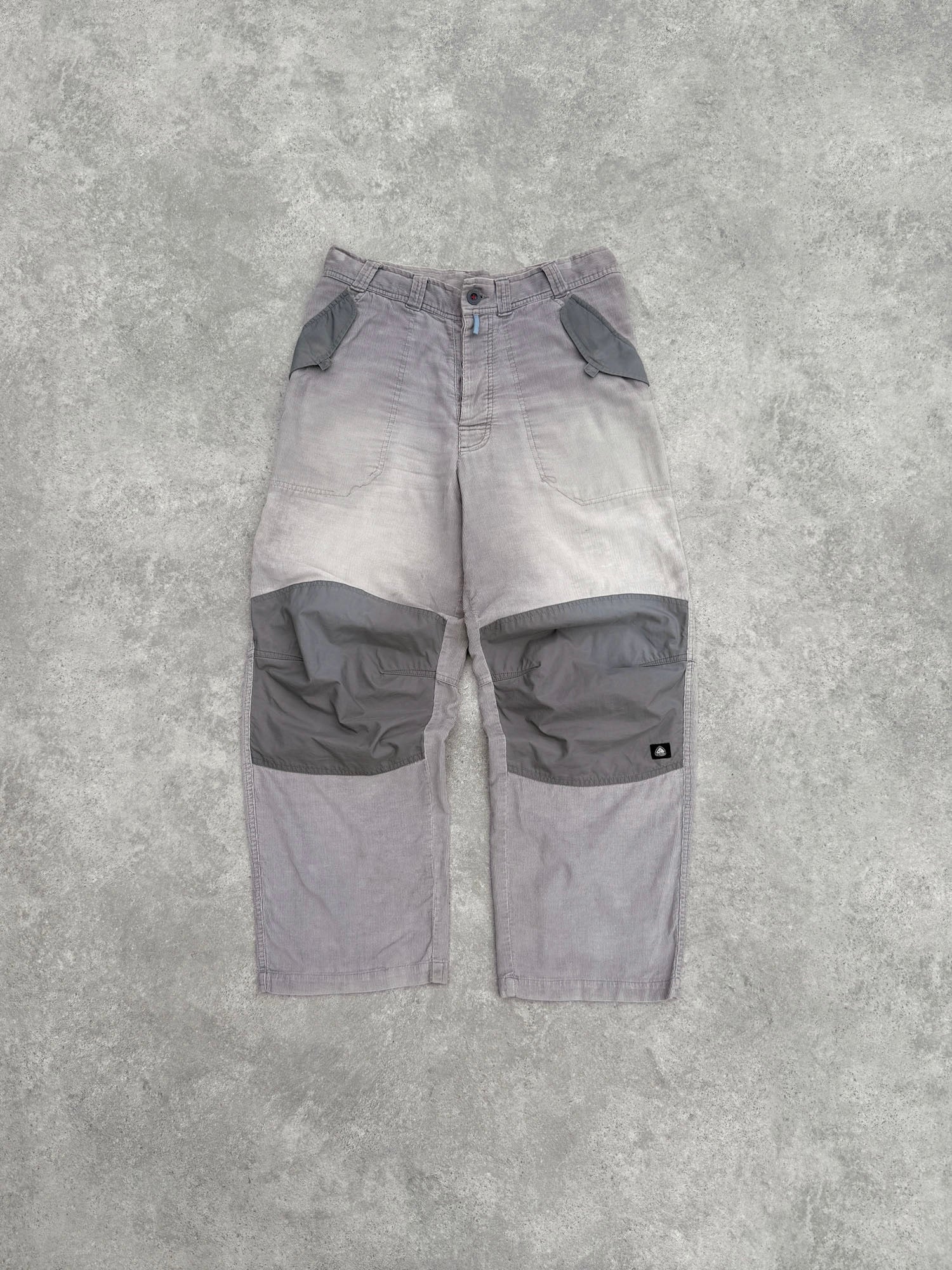 nike acg 2000s technical corduroy cargo trousers in faded grey, front view