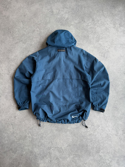 nike acg 1990s lightweight technical waterproof jacket in blue, back view