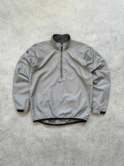 nike acg 1990s packable shell jacket in grey, front view