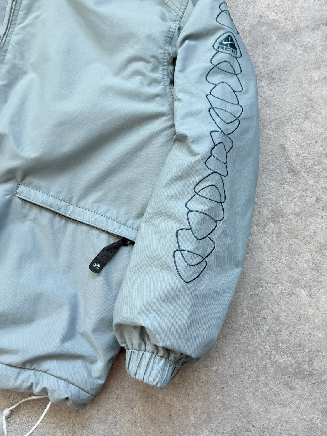 nike acg 2000s reversible storm clad fleece jacket, sleeve logo detail