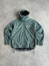 nike acg 1990s storm fit heavyweight technical waterproof jacket in muted green, front view
