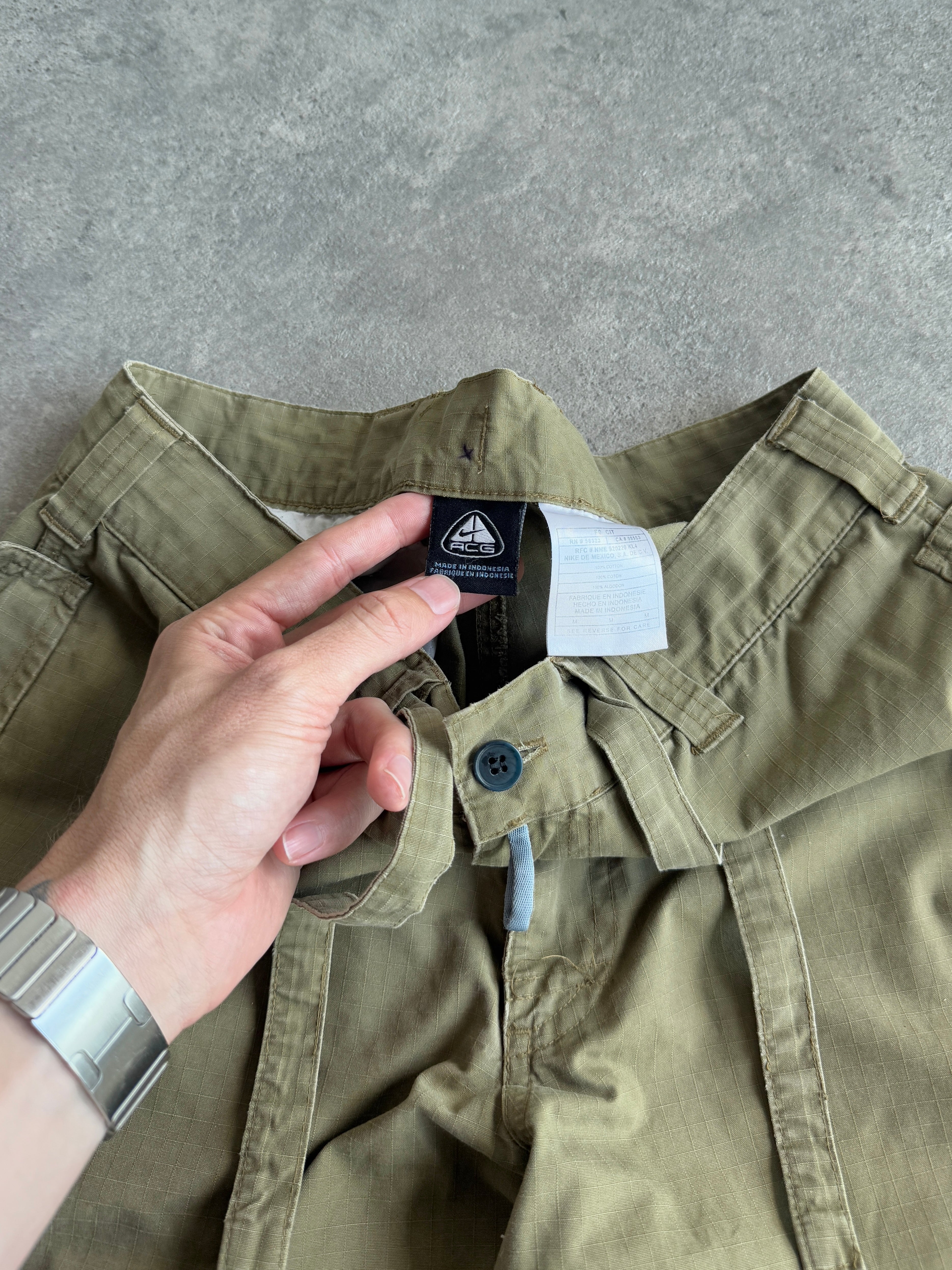 nike acg 2000s technical ripstop cargo trousers, acg branded zip pull detail