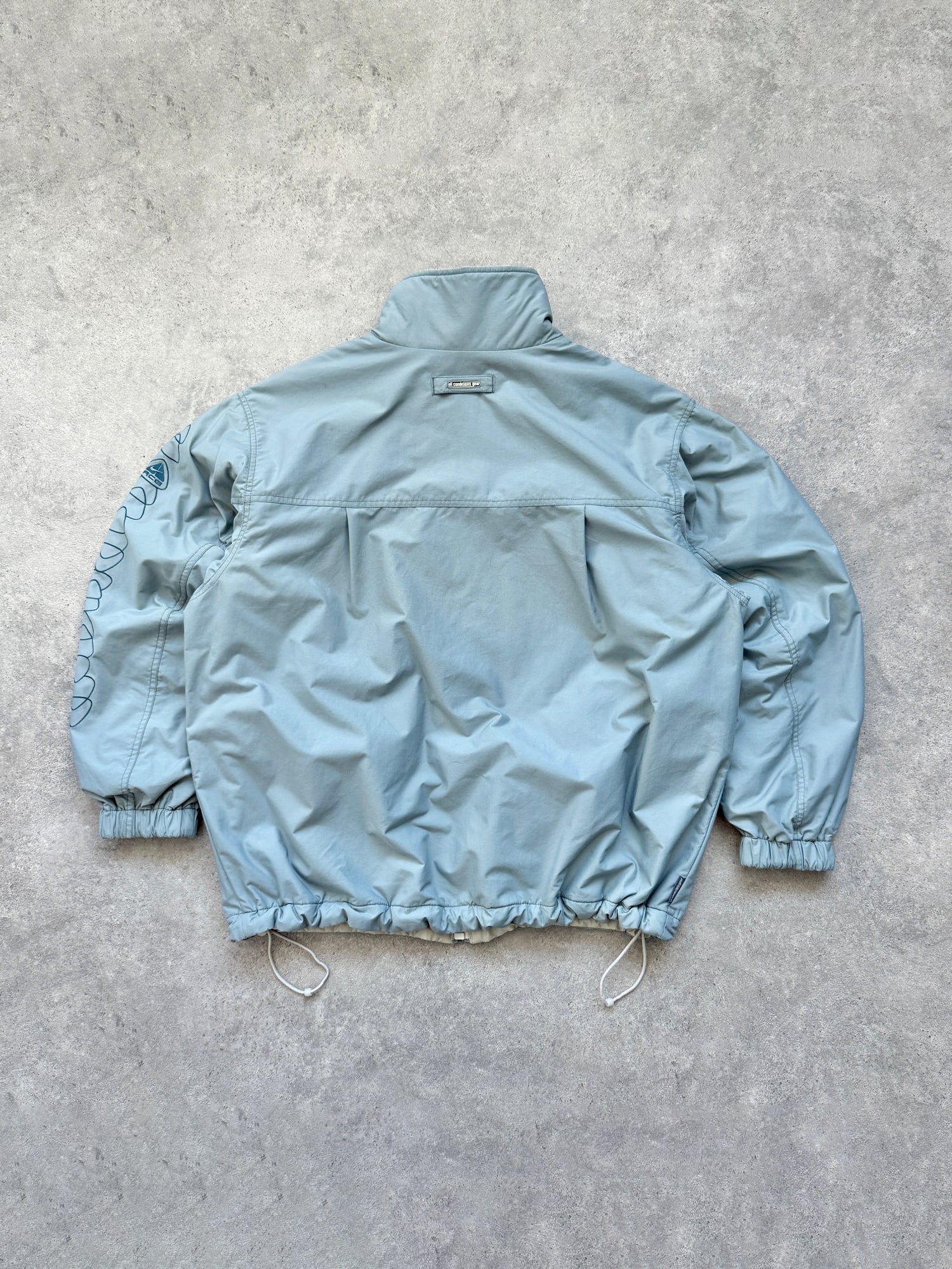 nike acg 2000s reversible storm clad fleece jacket, hem drawcord detail