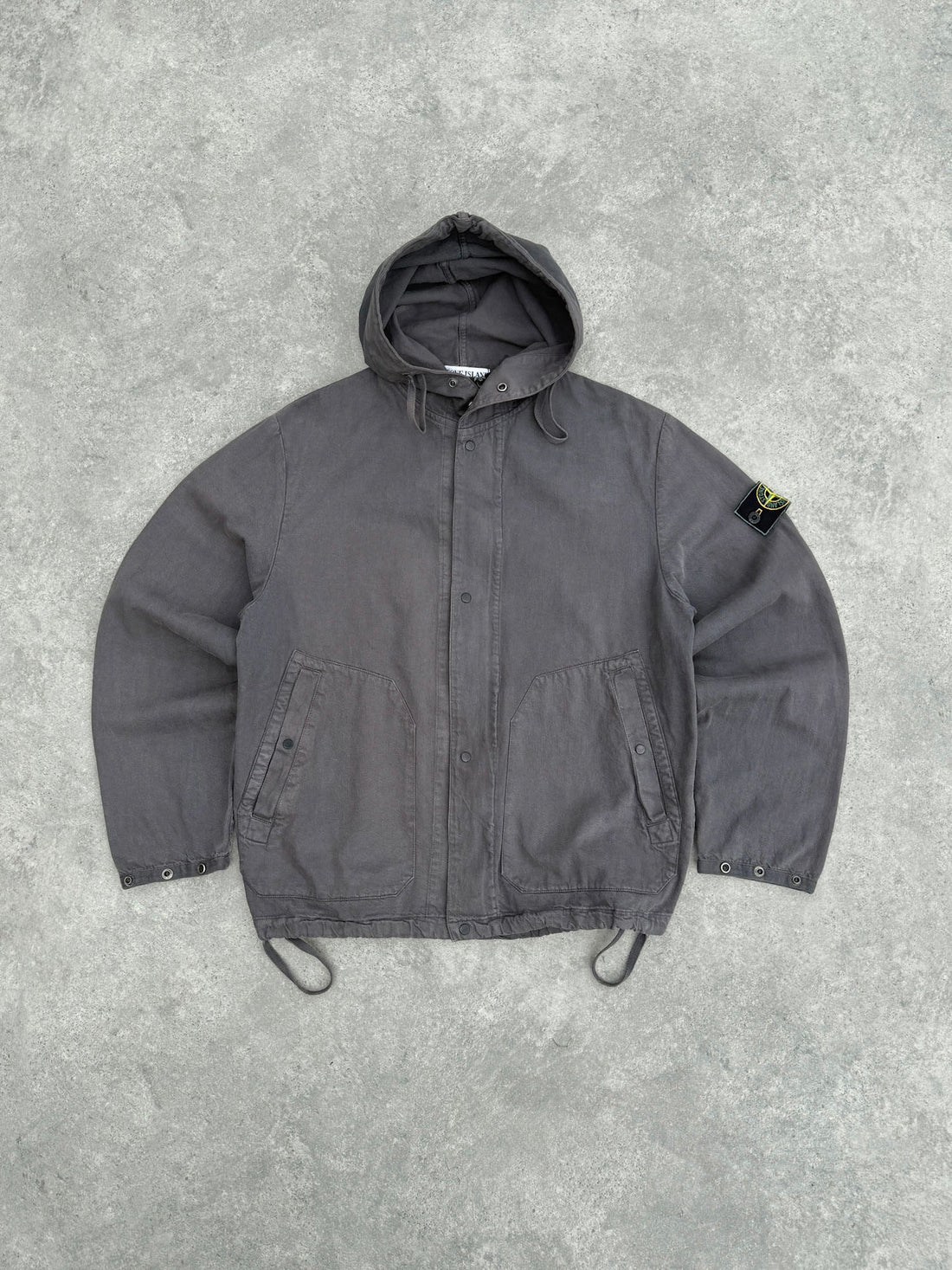 stone island s/s 1999 garment dyed hooded jacket in charcoal grey, front view