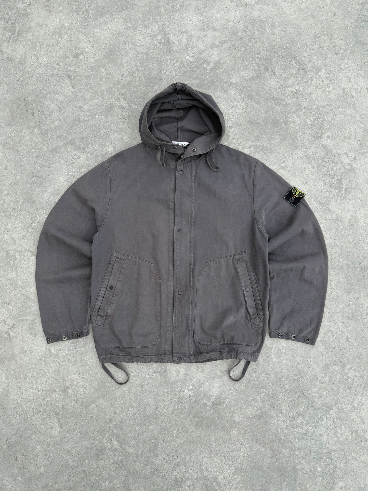 stone island s/s 1999 garment dyed hooded jacket in charcoal grey, front view