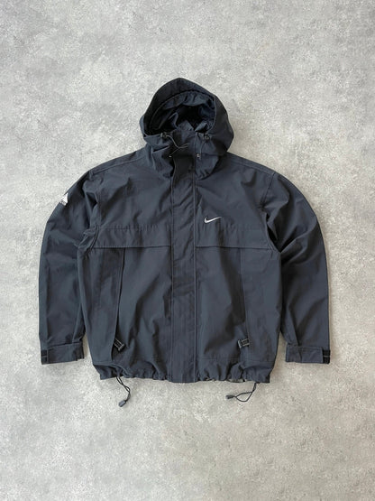 nike acg 1990s lightweight technical ripstop waterproof jacket in black, front view