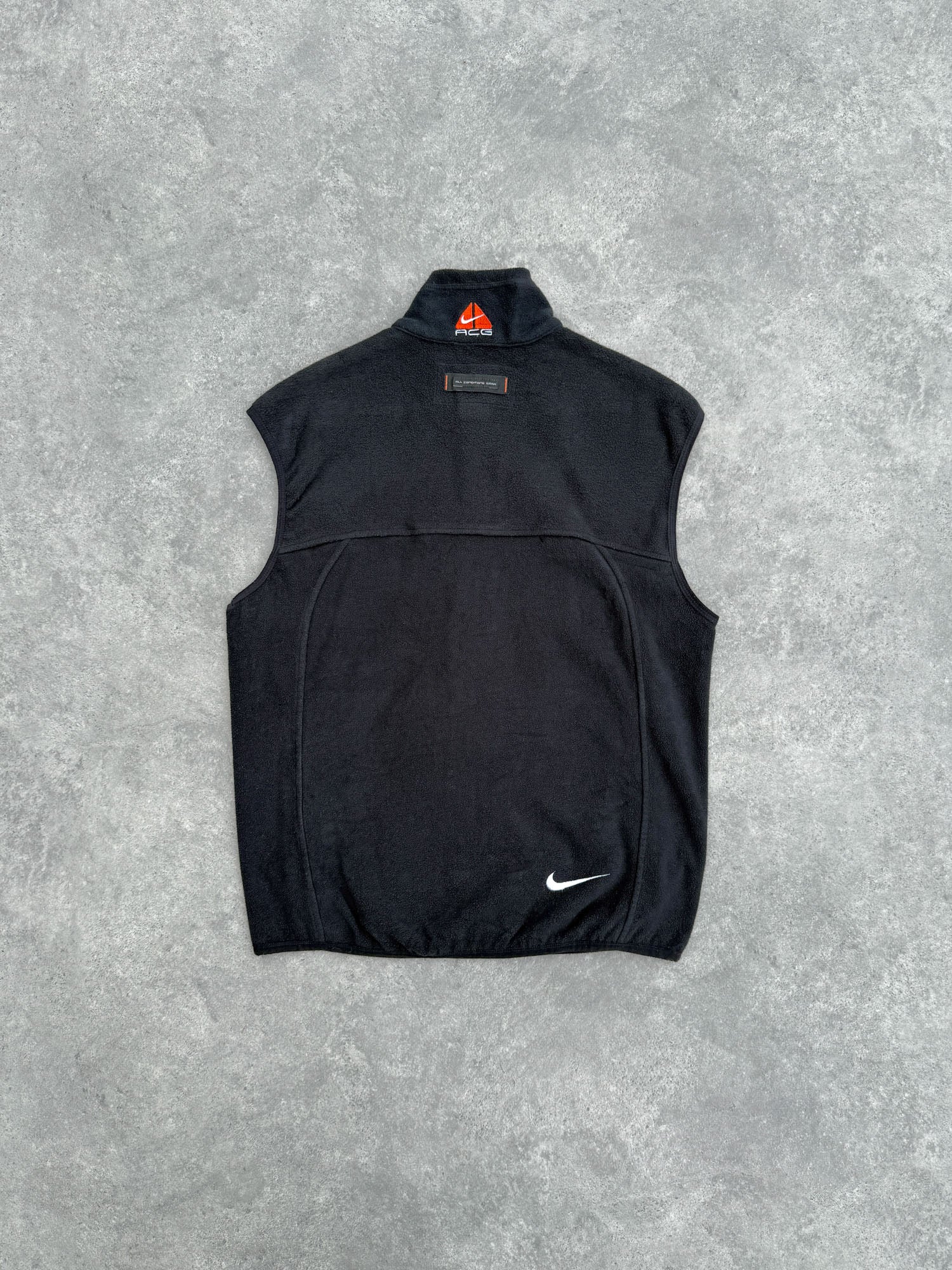 nike acg 1990s technical fleece vest jacket in black orange, back view